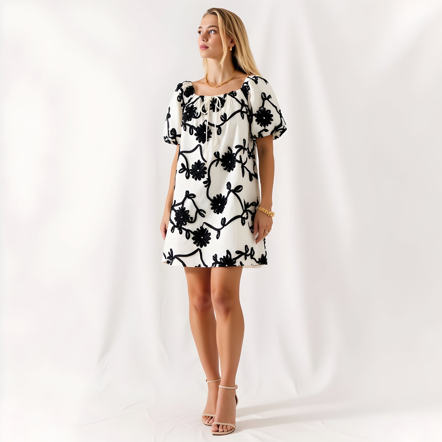 Textured Floral Mini Dress with Puff Sleeves and Tie Neckline