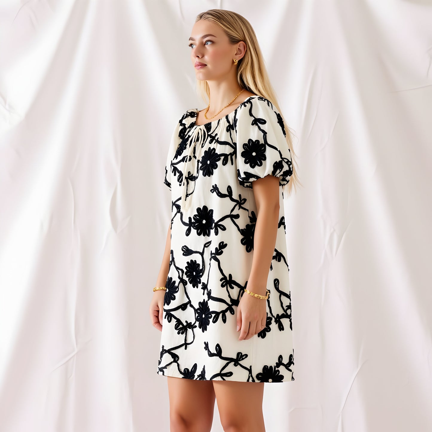 Textured Floral Mini Dress with Puff Sleeves and Tie Neckline
