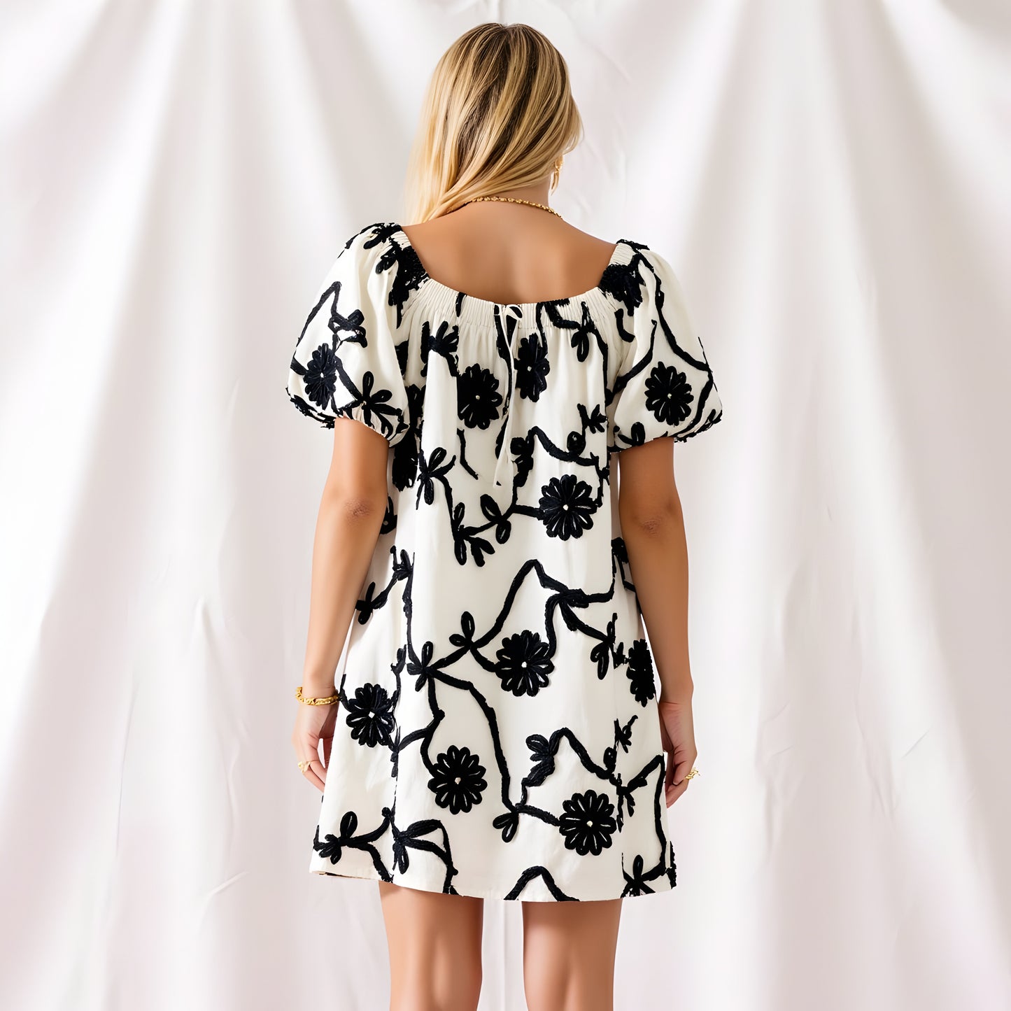 Textured Floral Mini Dress with Puff Sleeves and Tie Neckline