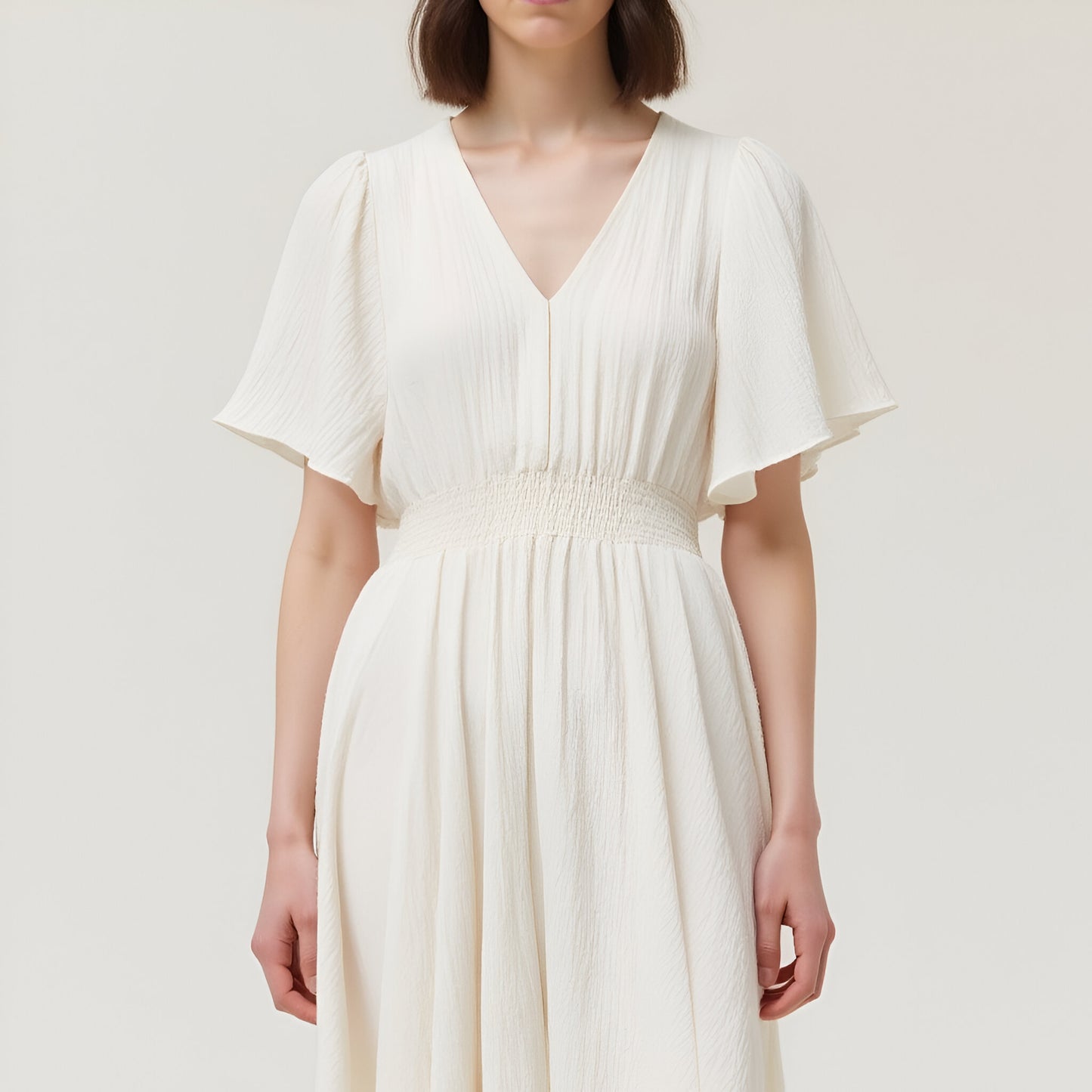 V-Neck Midi Dress with Flutter Sleeves and Handkerchief Hem Detail