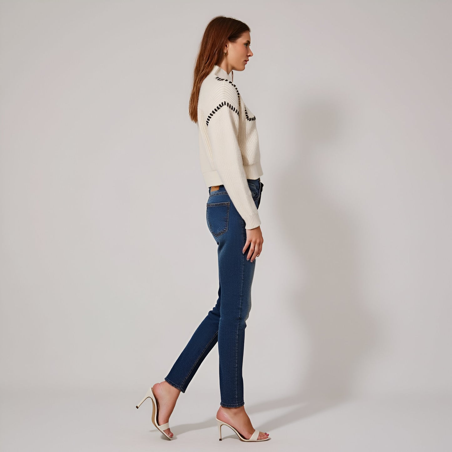 Chunky Knit Cropped Sweater with Ribbed High Neck and Bold Whip Stitch Accents