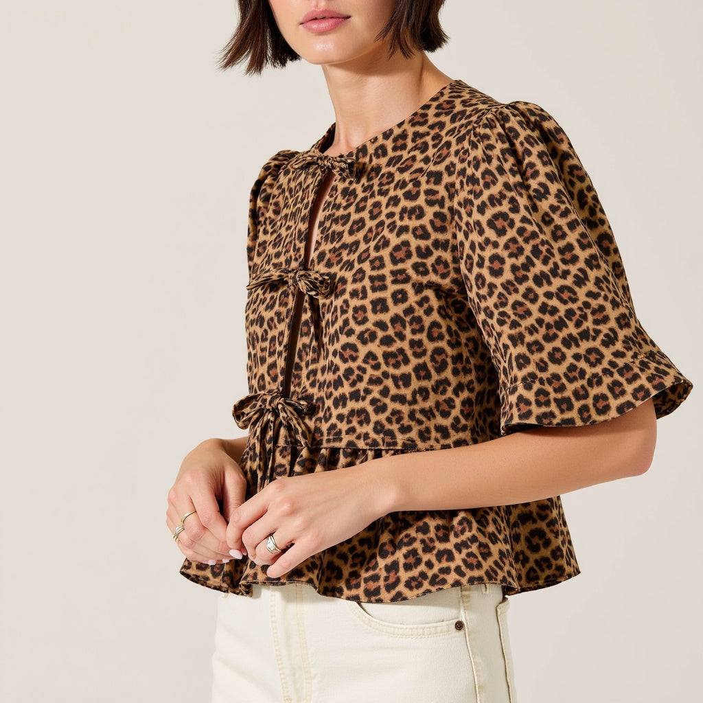 Leopard Print Peplum Top with Front Tie Closures and Short Puff Sleeves