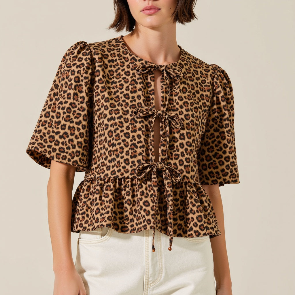 Leopard Print Peplum Top with Front Tie Closures and Short Puff Sleeves