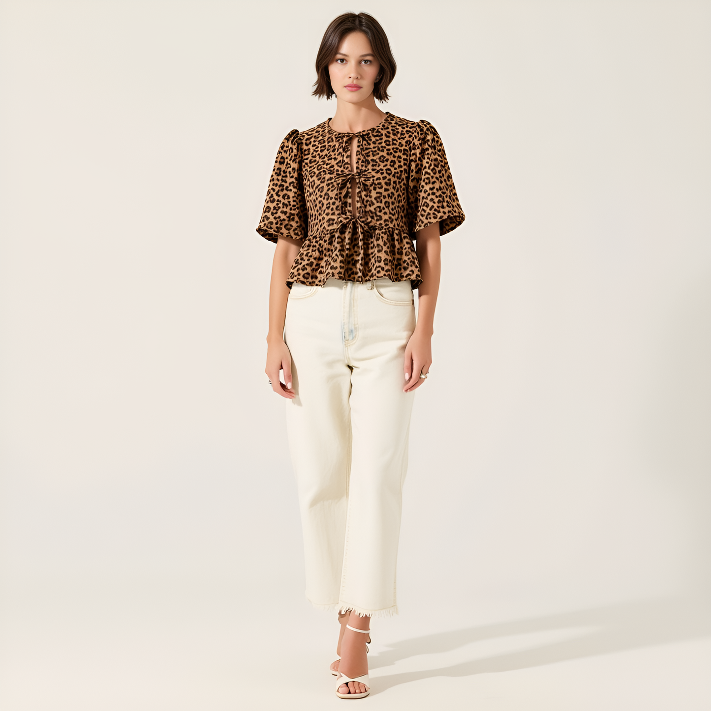 Leopard Print Peplum Top with Front Tie Closures and Short Puff Sleeves