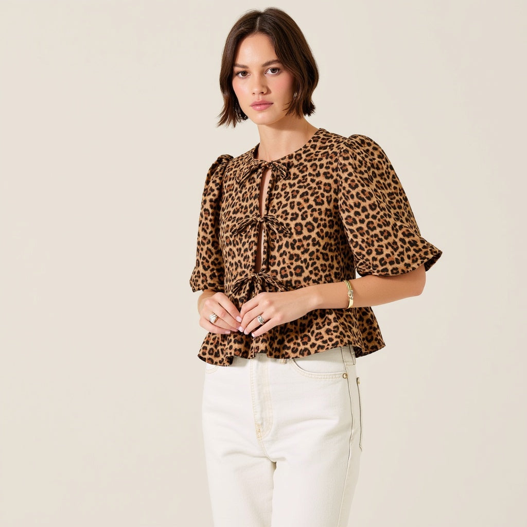 Leopard Print Peplum Top with Front Tie Closures and Short Puff Sleeves