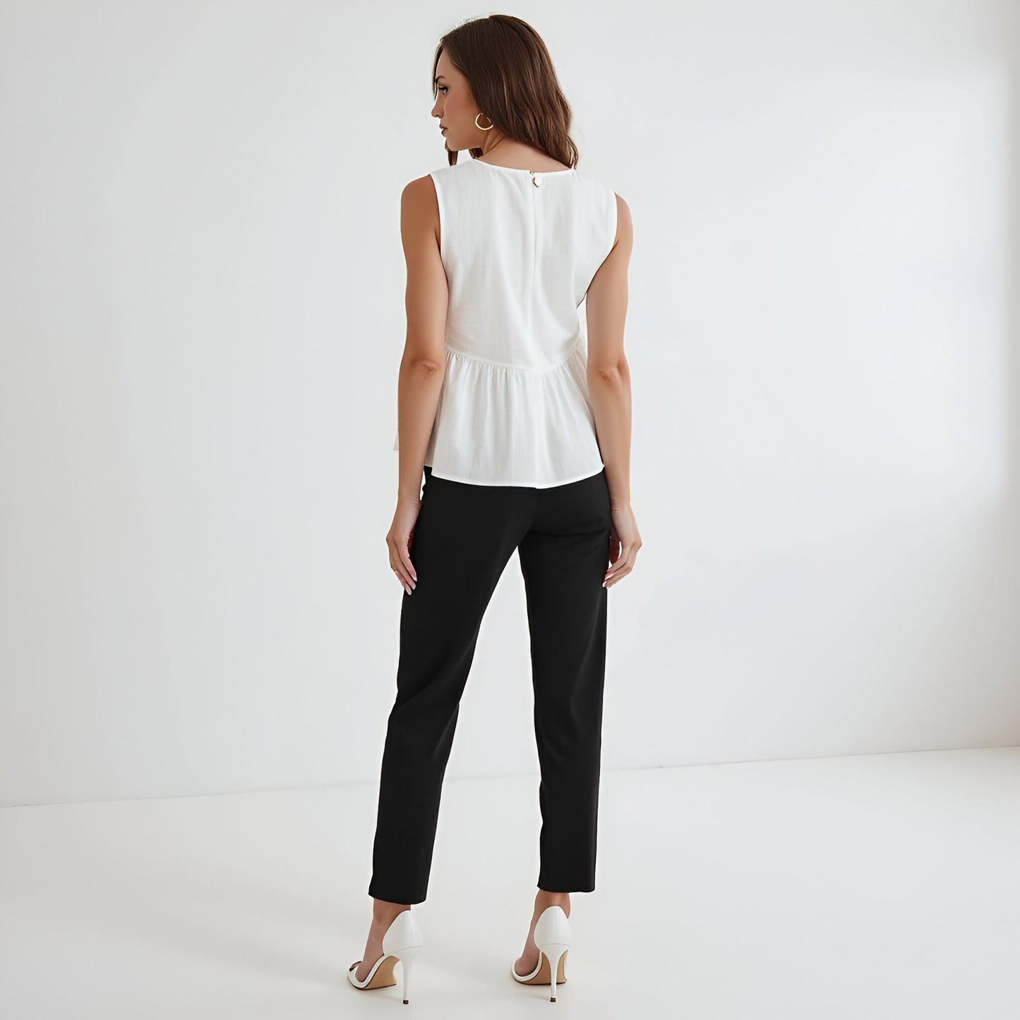 Sleeveless Peplum Top with Asymmetric Pearl Button Front