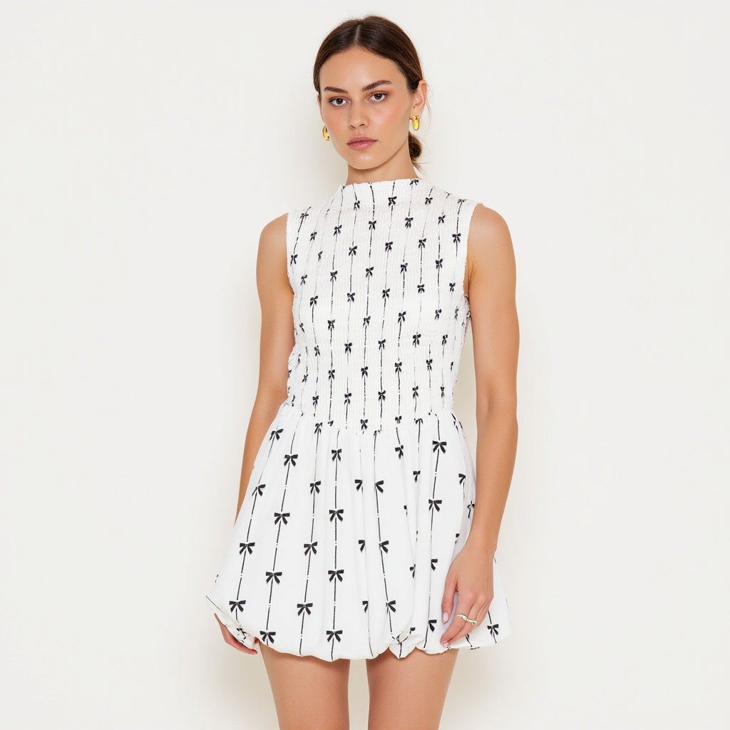 Sleeveless Smocked Mini Dress with High Neckline and Embroidered Bow Motif