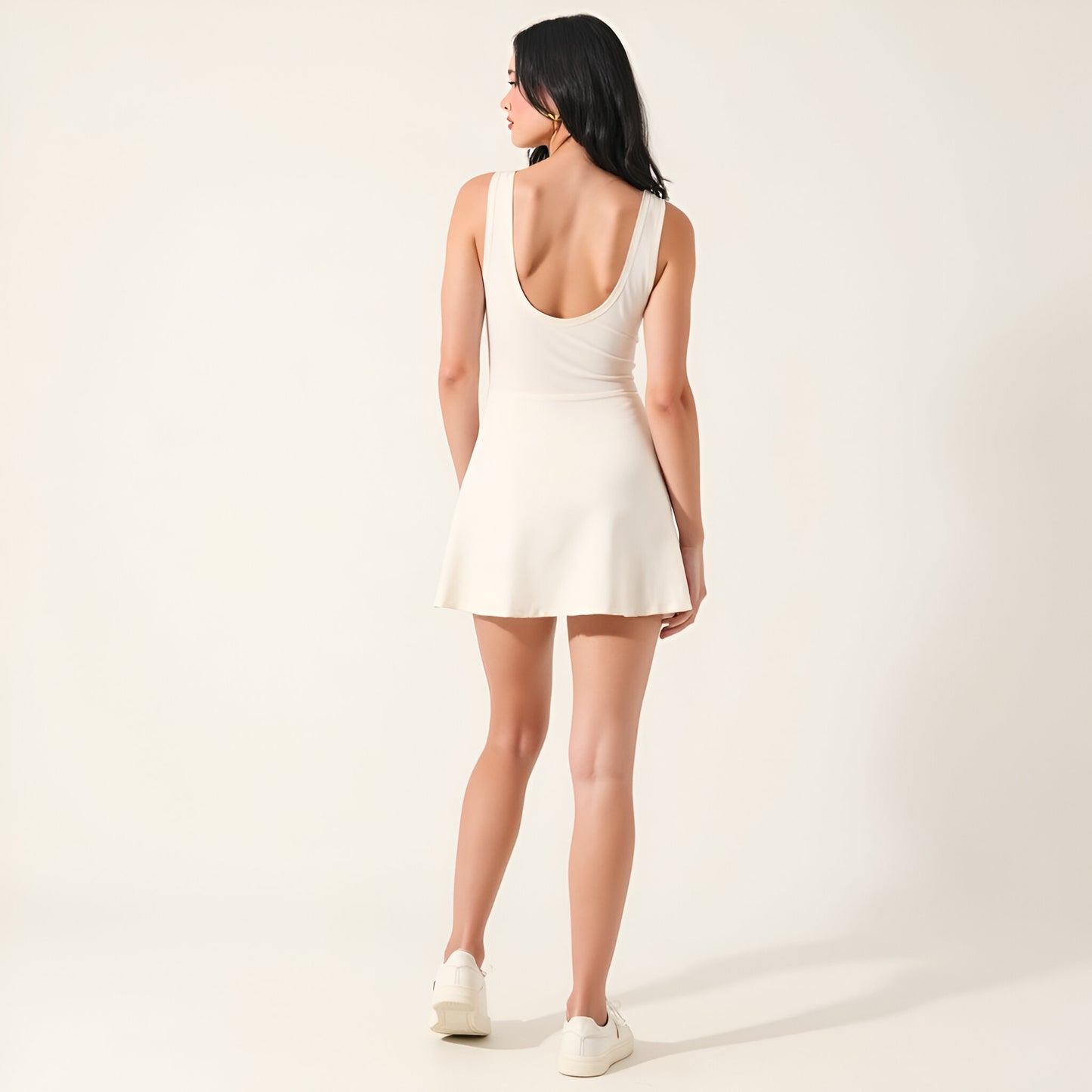 Sleeveless Active Romper with Side Tie Skirt Overlay and Crew Neckline