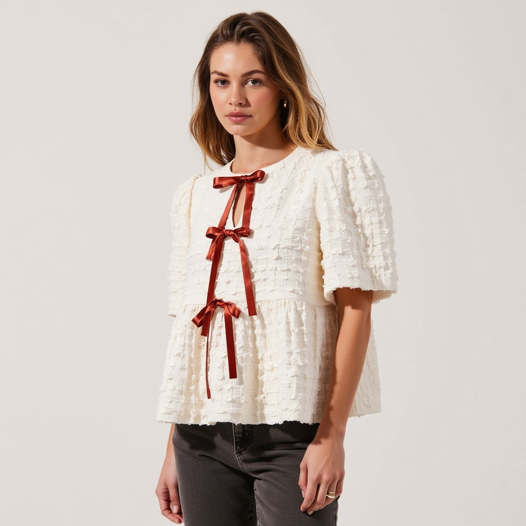 Textured Puff-Sleeve Peplum Blouse with Bow-Tie Front