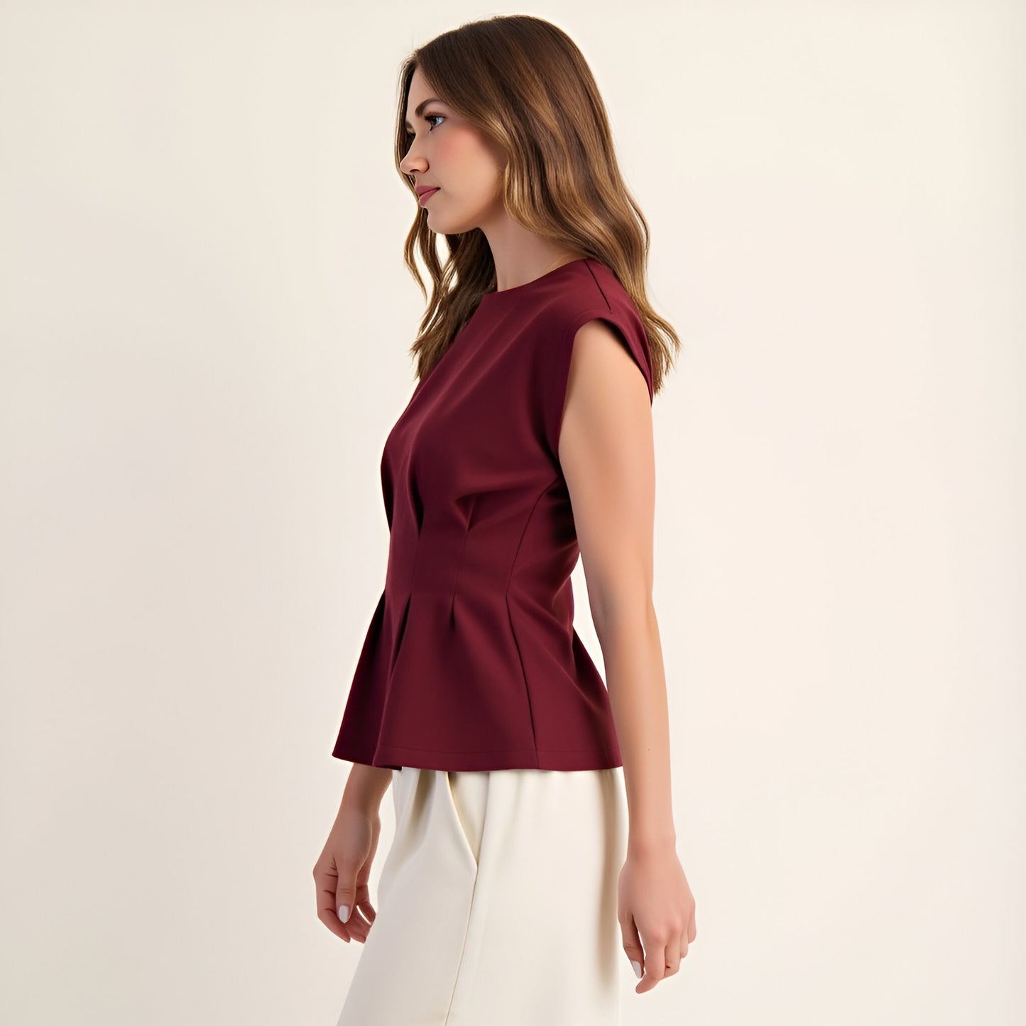 Cap Sleeve Peplum Top with Structured Pleats and Round Neckline