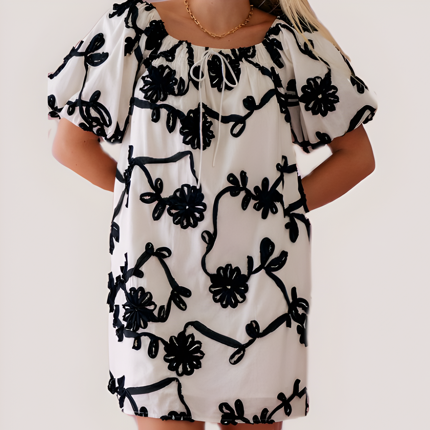 Textured Floral Mini Dress with Puff Sleeves and Tie Neckline