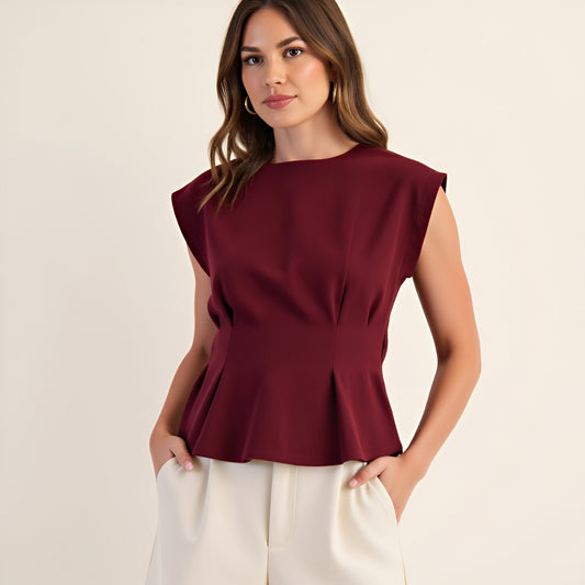 Cap Sleeve Peplum Top with Structured Pleats and Round Neckline